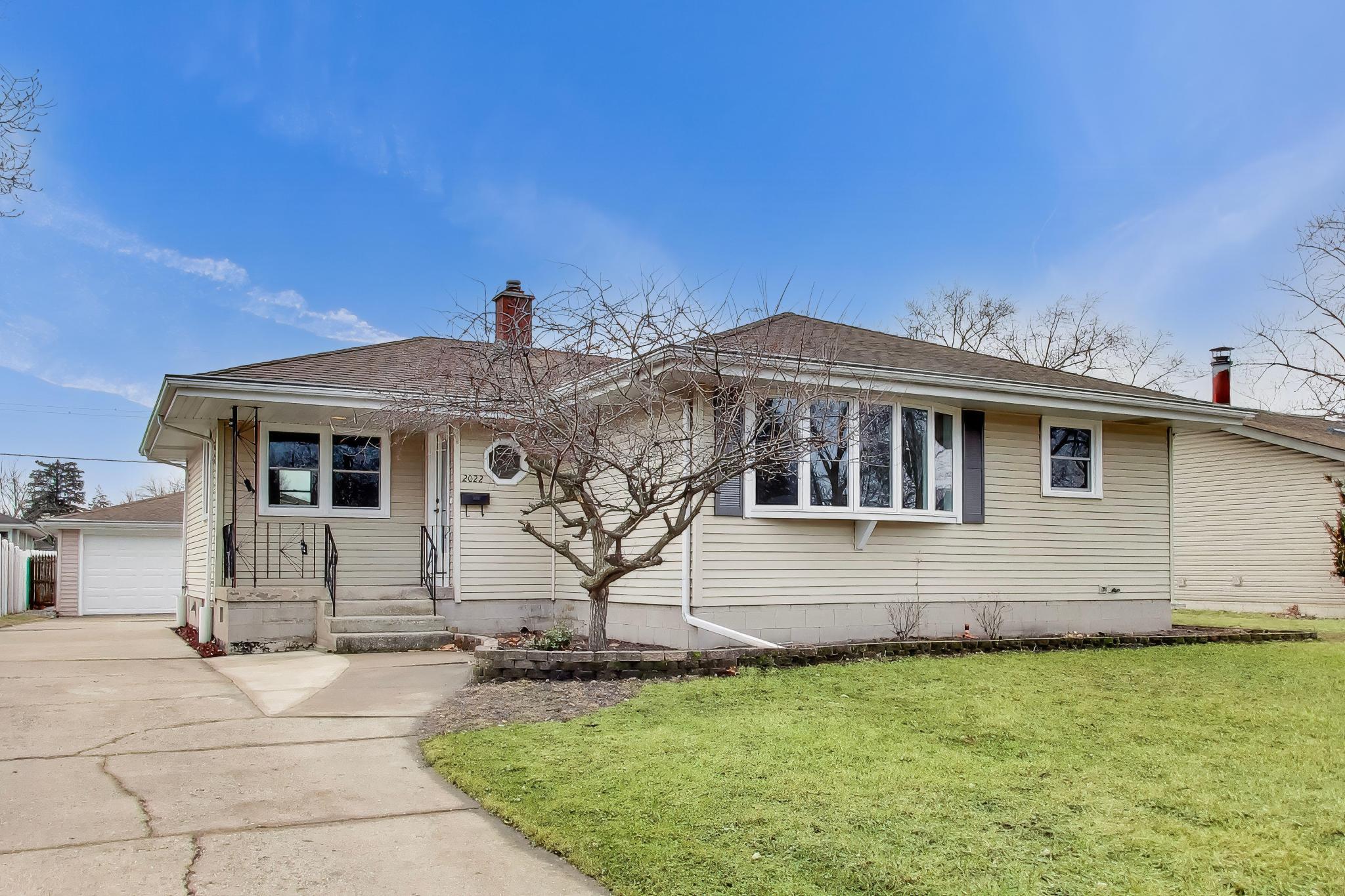 2022 38th Street Highland, IN 46322 - Photo 2 of 41 a front view of a house with a yard