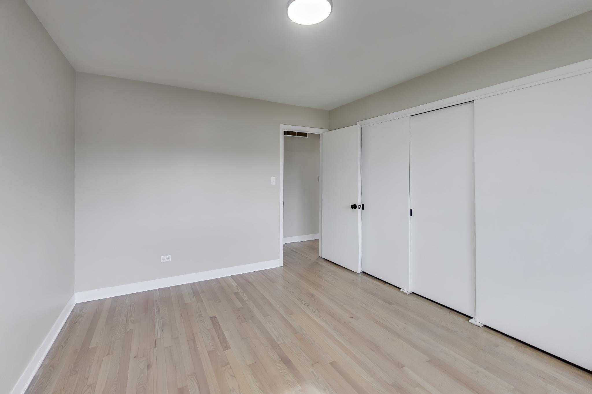 2022 38th Street Highland, IN 46322 - Photo 22 of 41 a view of an empty room with wooden floor