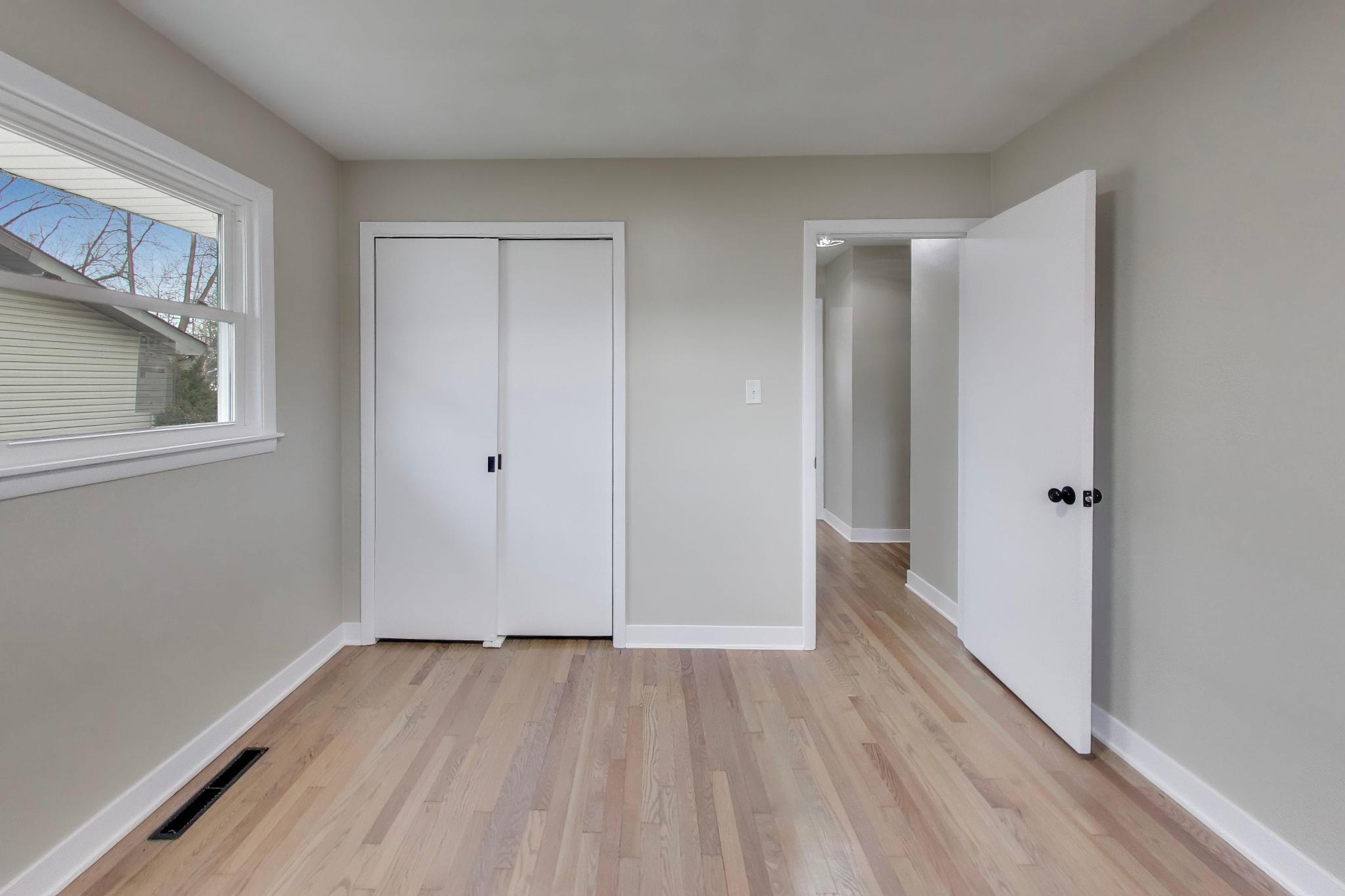 2022 38th Street Highland, IN 46322 - Photo 25 of 41 a view of an empty room with wooden floor and a window