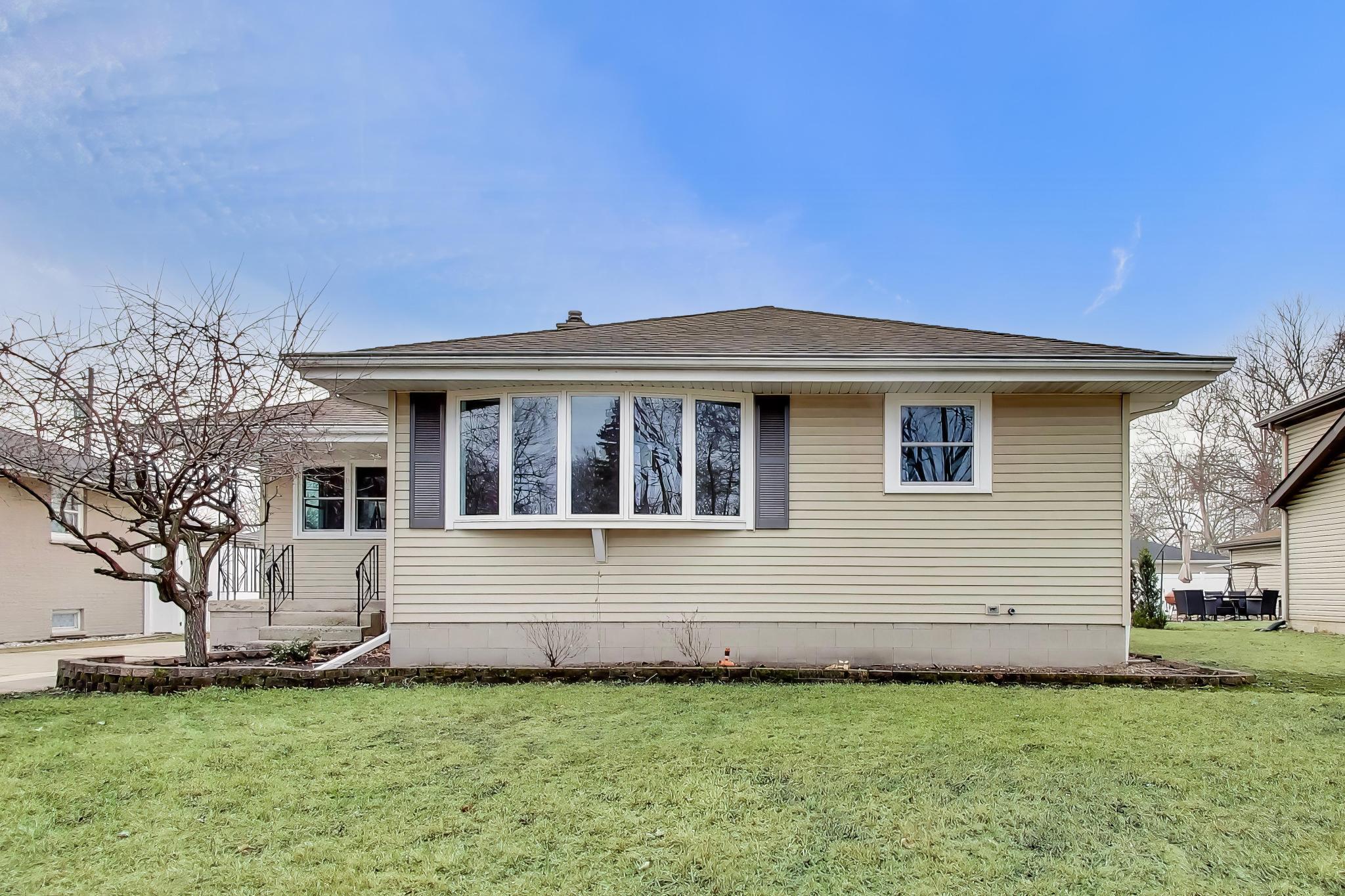 2022 38th Street Highland, IN 46322 - Photo 3 of 41 a front view of a house with a garden