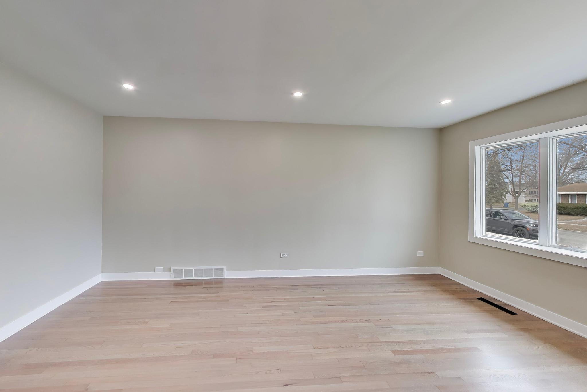 2022 38th Street Highland, IN 46322 - Photo 9 of 41 a view of empty room with wooden floor and fan