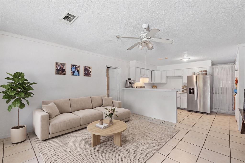4509 Diamond D Road Lone Oak, TX 75453 - Photo 36 of 36 a living room with furniture and a chandelier