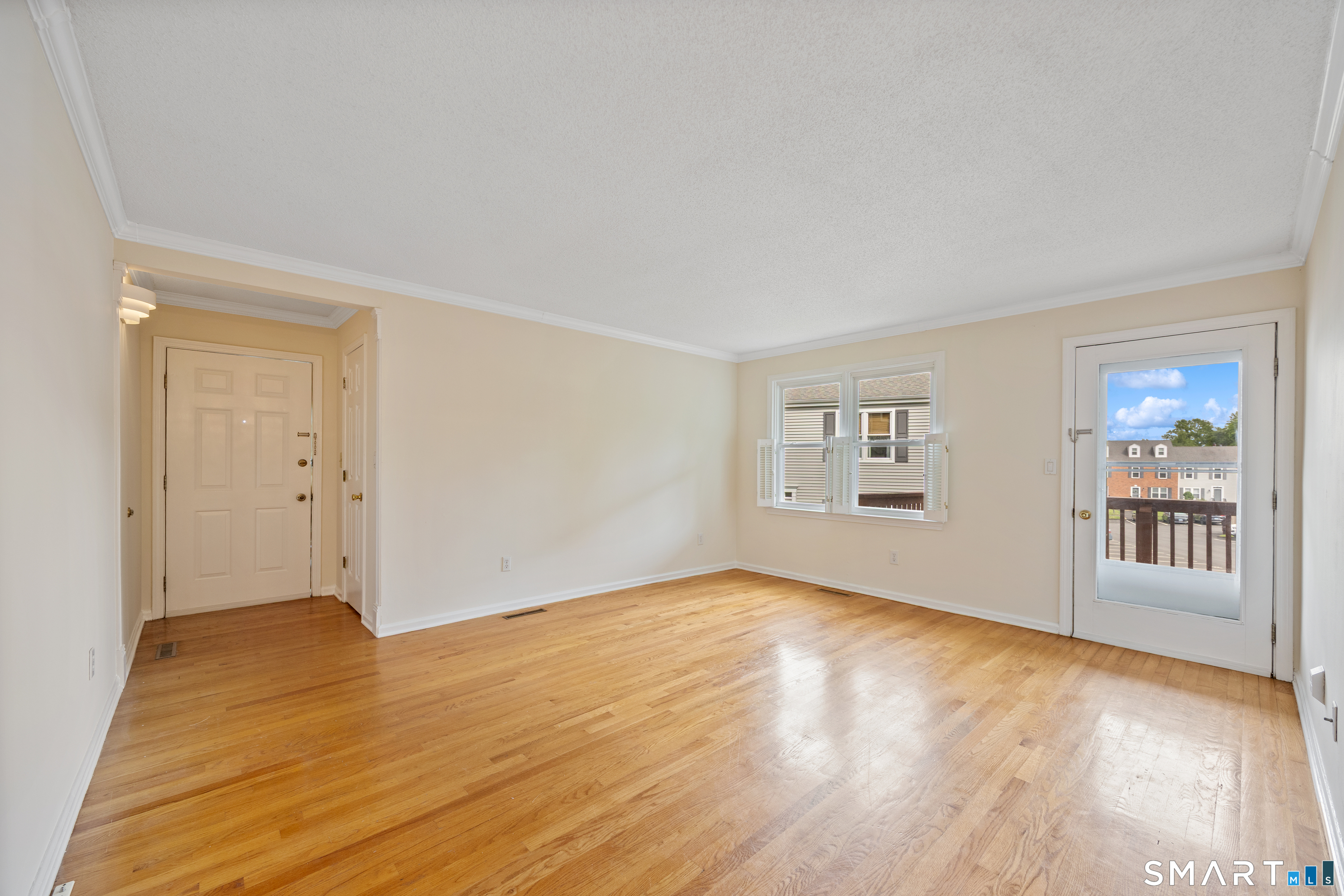 111 Strathmore Lane, Unit 111 Wallingford, CT 06492 - Photo 4 of 32 Living room as seen from dining room