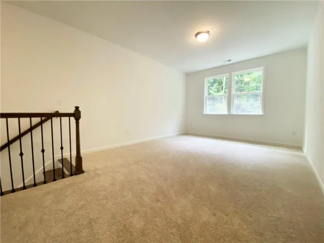 a view of a hallway with windows