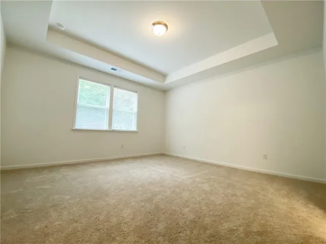 a bathroom with double vanity sinks and a shower