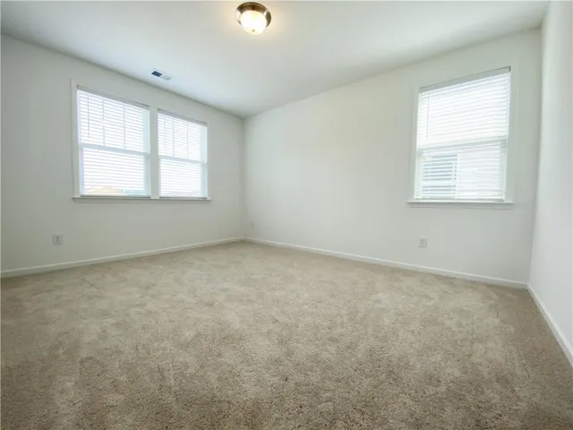 a bathroom with a bathtub sink vanity mirror and toilet
