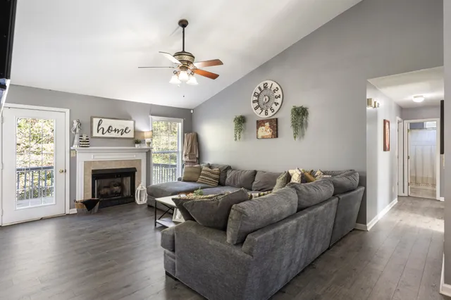 a living room with furniture and a fireplace