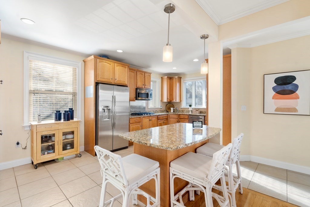 59 Elm Street Hingham, MA 02043 - Photo 15 of 33 a large kitchen with kitchen island granite countertop a large counter top appliances and cabinets