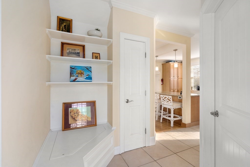 59 Elm Street Hingham, MA 02043 - Photo 16 of 33 a view of a livingroom with wooden floor and a fireplace