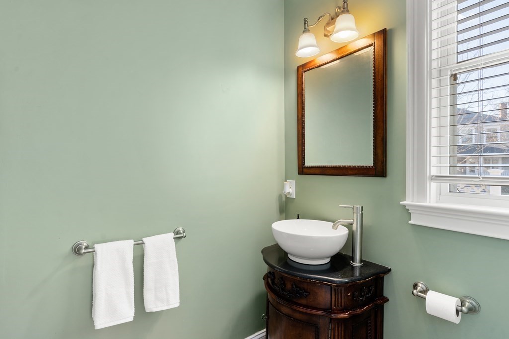 59 Elm Street Hingham, MA 02043 - Photo 17 of 33 a bathroom with a sink and a mirror