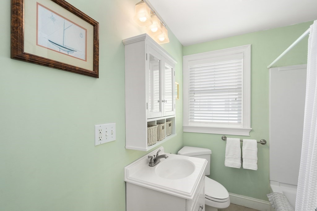59 Elm Street Hingham, MA 02043 - Photo 21 of 33 a white toilet sitting next to a bathroom sink