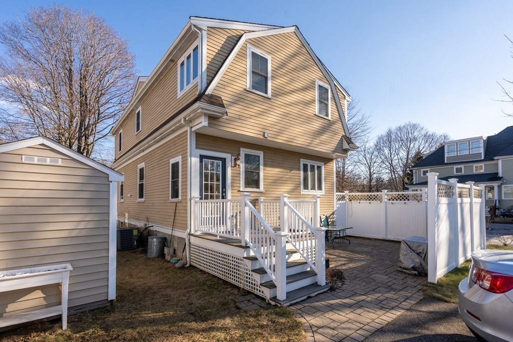 59 Elm Street Hingham, MA 02043 - Photo 28 of 33 a view of a patio with a table and chairs
