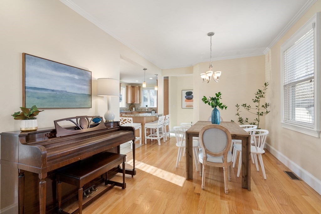 59 Elm Street Hingham, MA 02043 - Photo 8 of 33 a dining room with furniture a chandelier and wooden floor