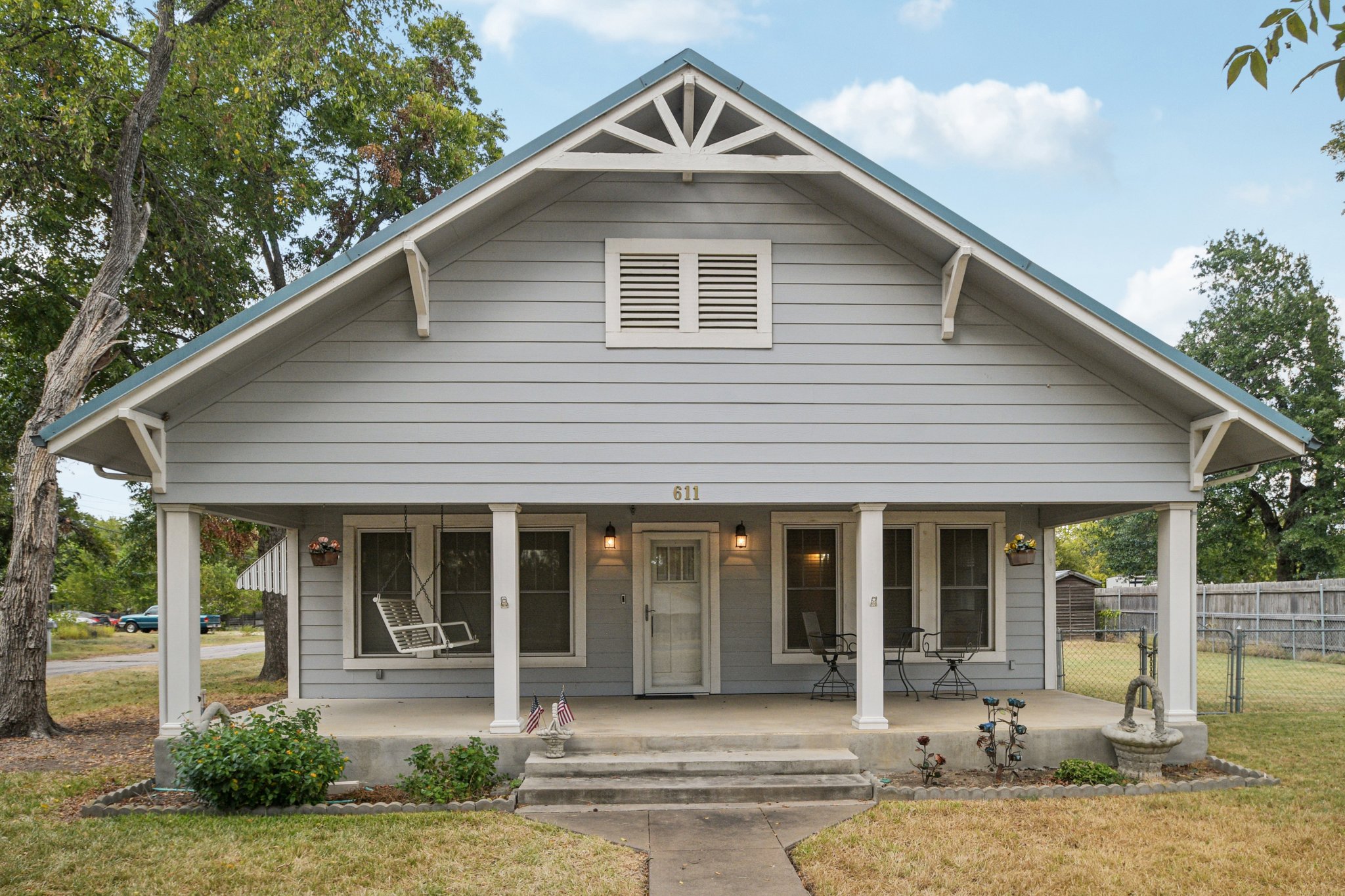 611 North Main Street Elgin, TX 78621 - Photo 25 of 26 a front view of a house with garden