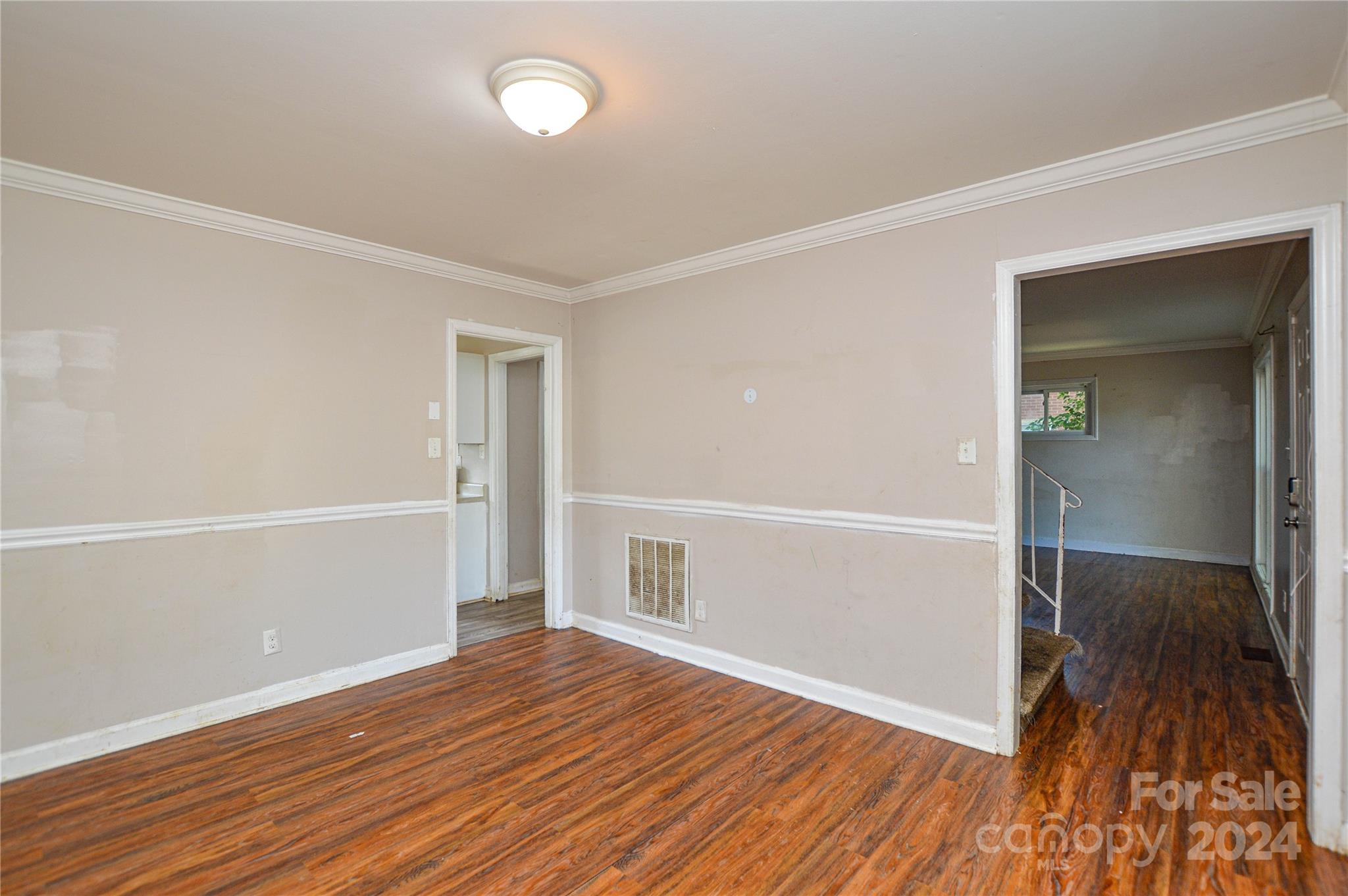 1138 White Plains Road Charlotte, NC 28213 - Photo 11 of 36 wooden floor in an empty room with a window