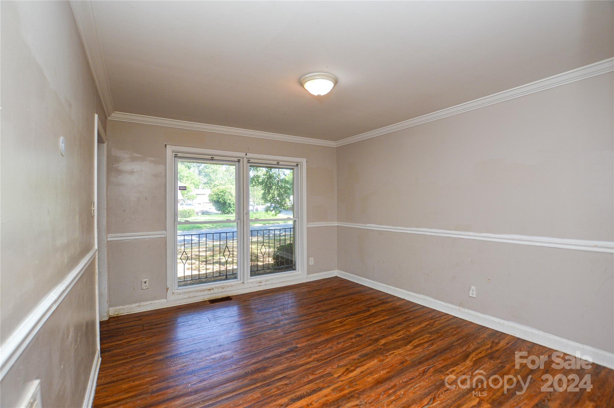 1138 White Plains Road Charlotte, NC 28213 - Photo 12 of 36 wooden floor in an empty room with a window