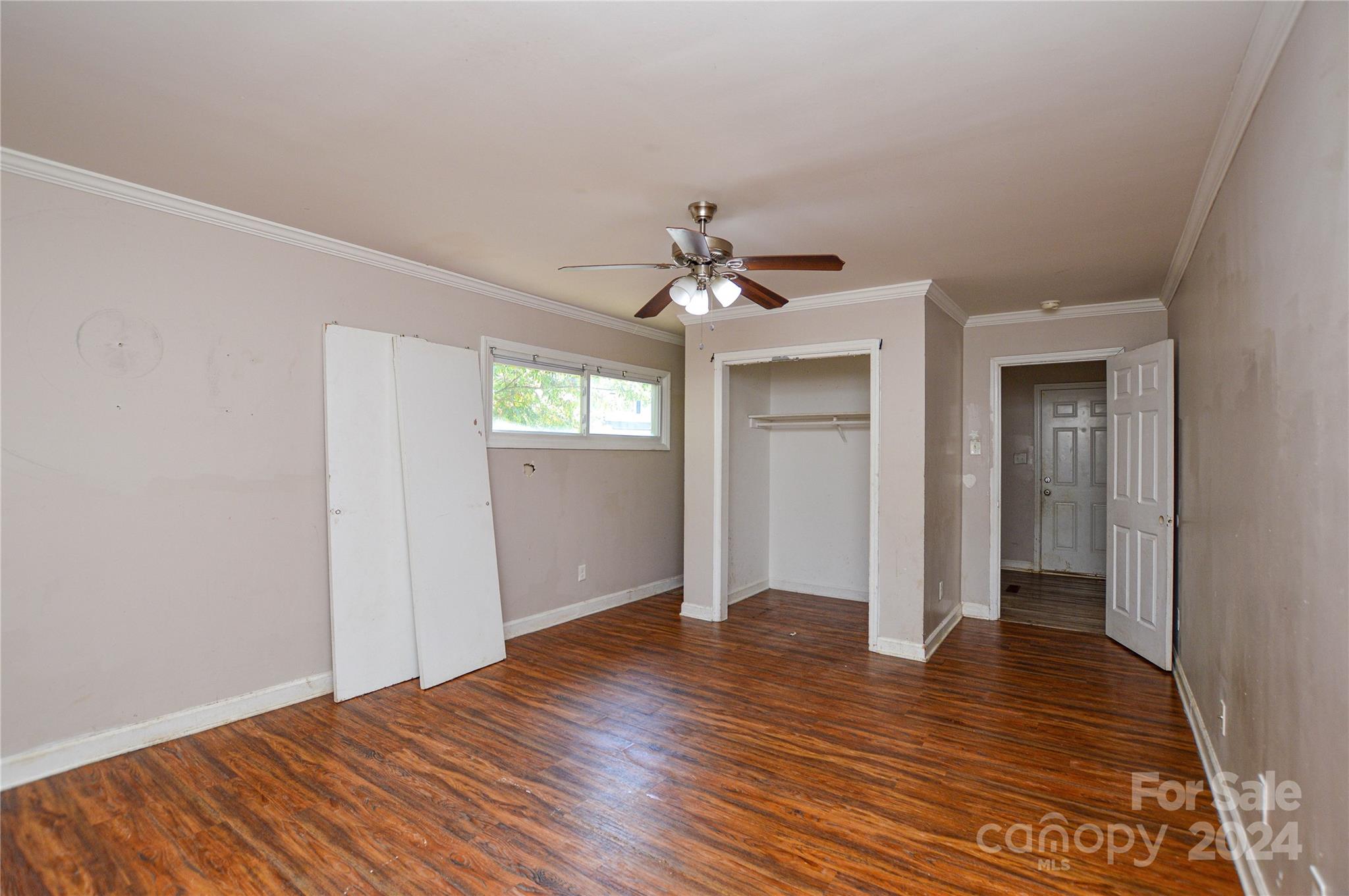 1138 White Plains Road Charlotte, NC 28213 - Photo 19 of 36 a view of an empty room with window and wooden floor