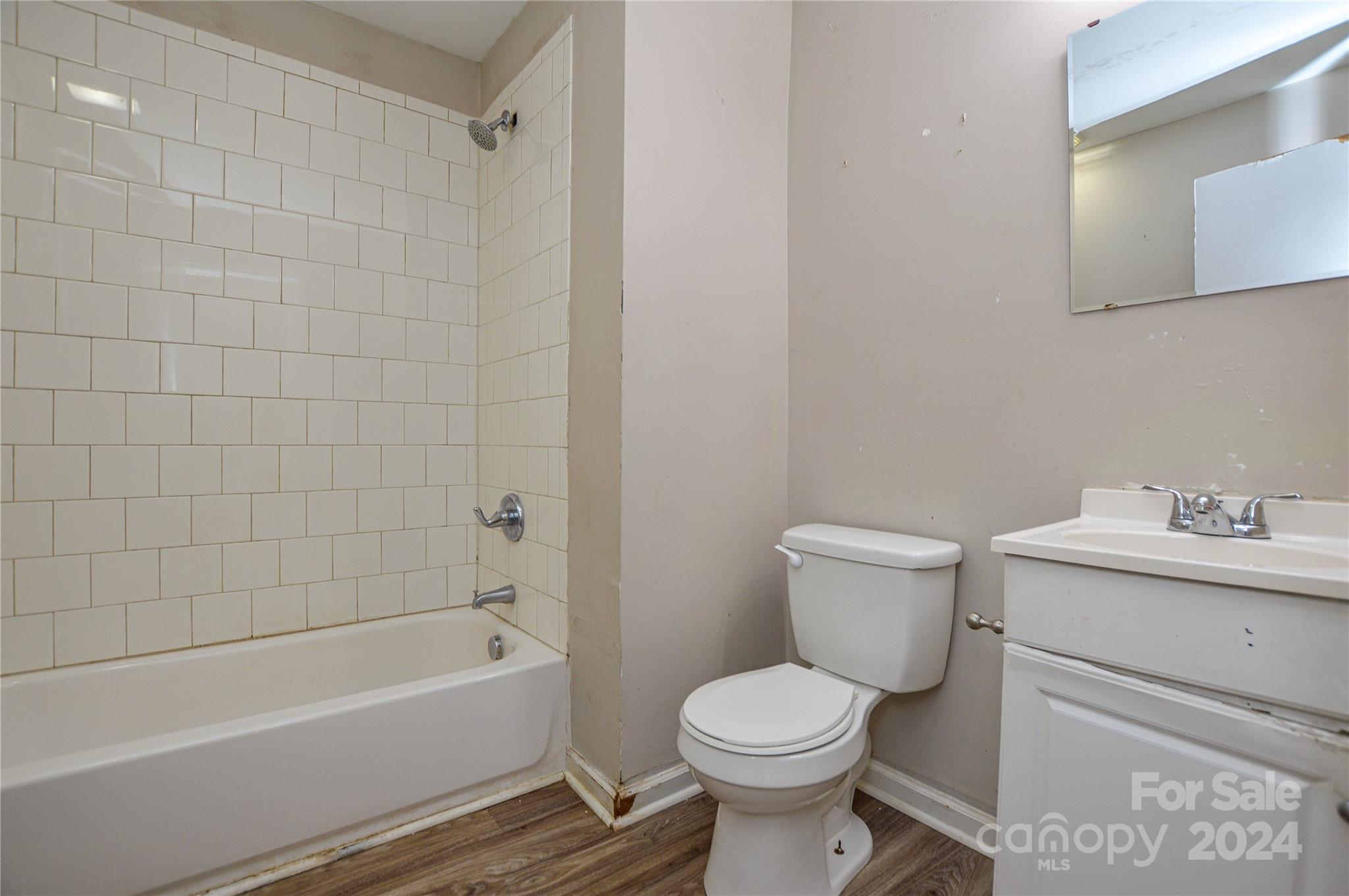 1138 White Plains Road Charlotte, NC 28213 - Photo 20 of 36 a bathroom with a toilet a sink and bathtub