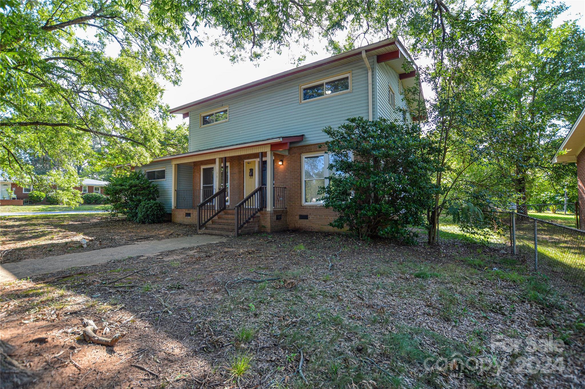 1138 White Plains Road Charlotte, NC 28213 - Photo 2 of 36 a view of a house with a yard