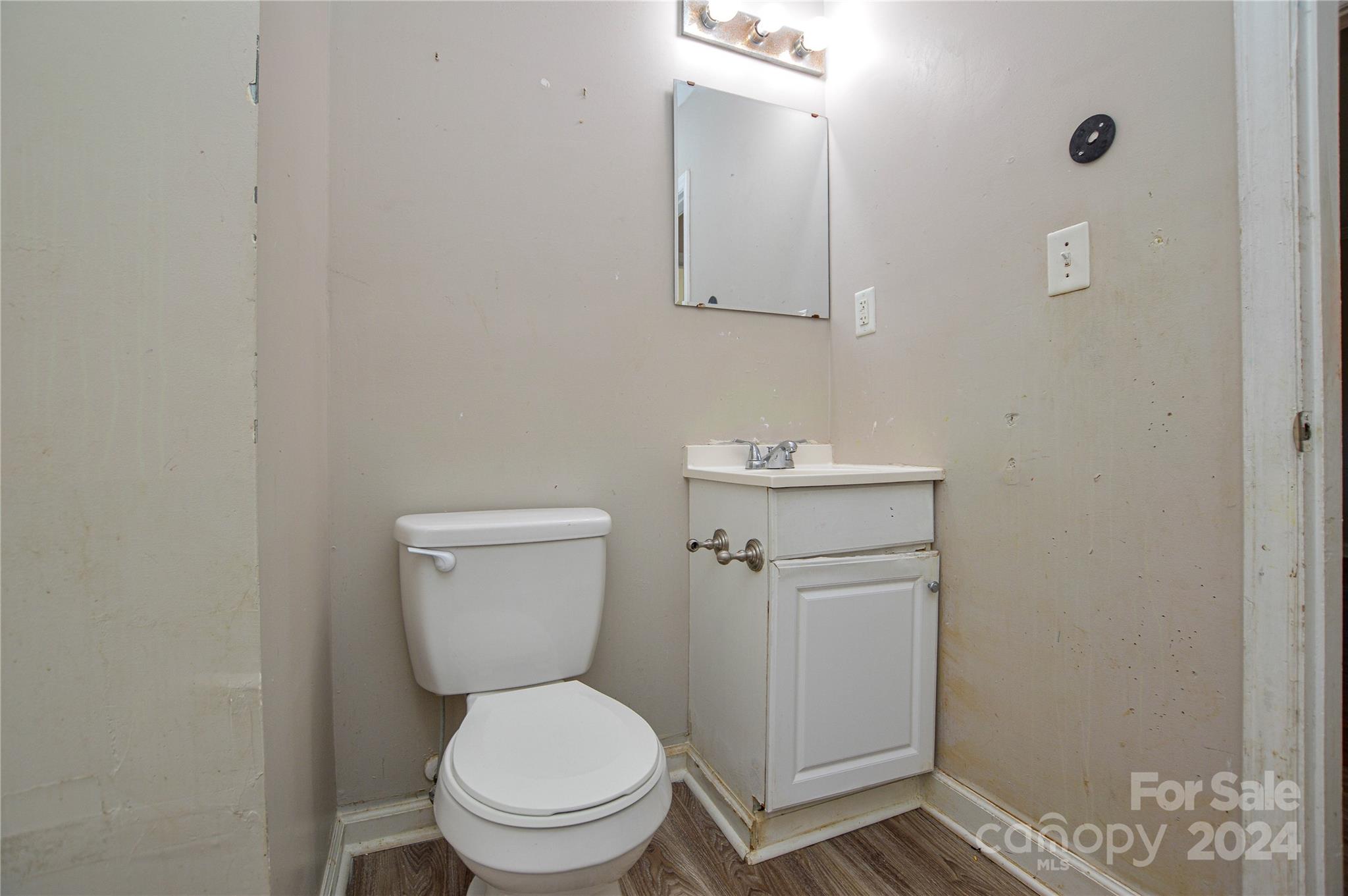 1138 White Plains Road Charlotte, NC 28213 - Photo 21 of 36 a white toilet sitting next to a bathroom sink