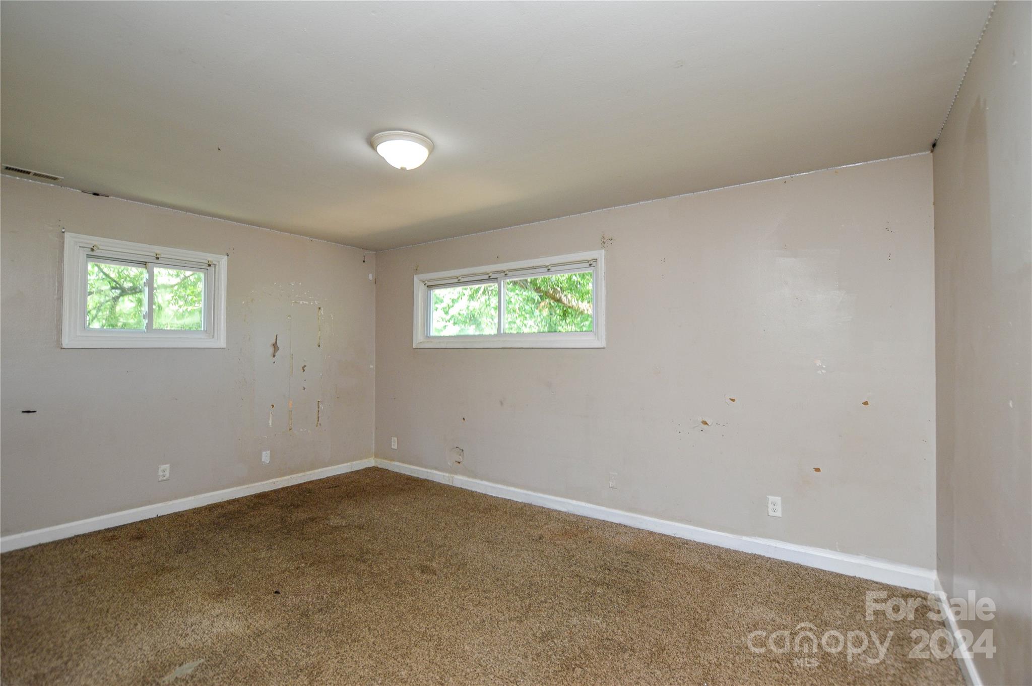 1138 White Plains Road Charlotte, NC 28213 - Photo 25 of 36 an empty room with windows