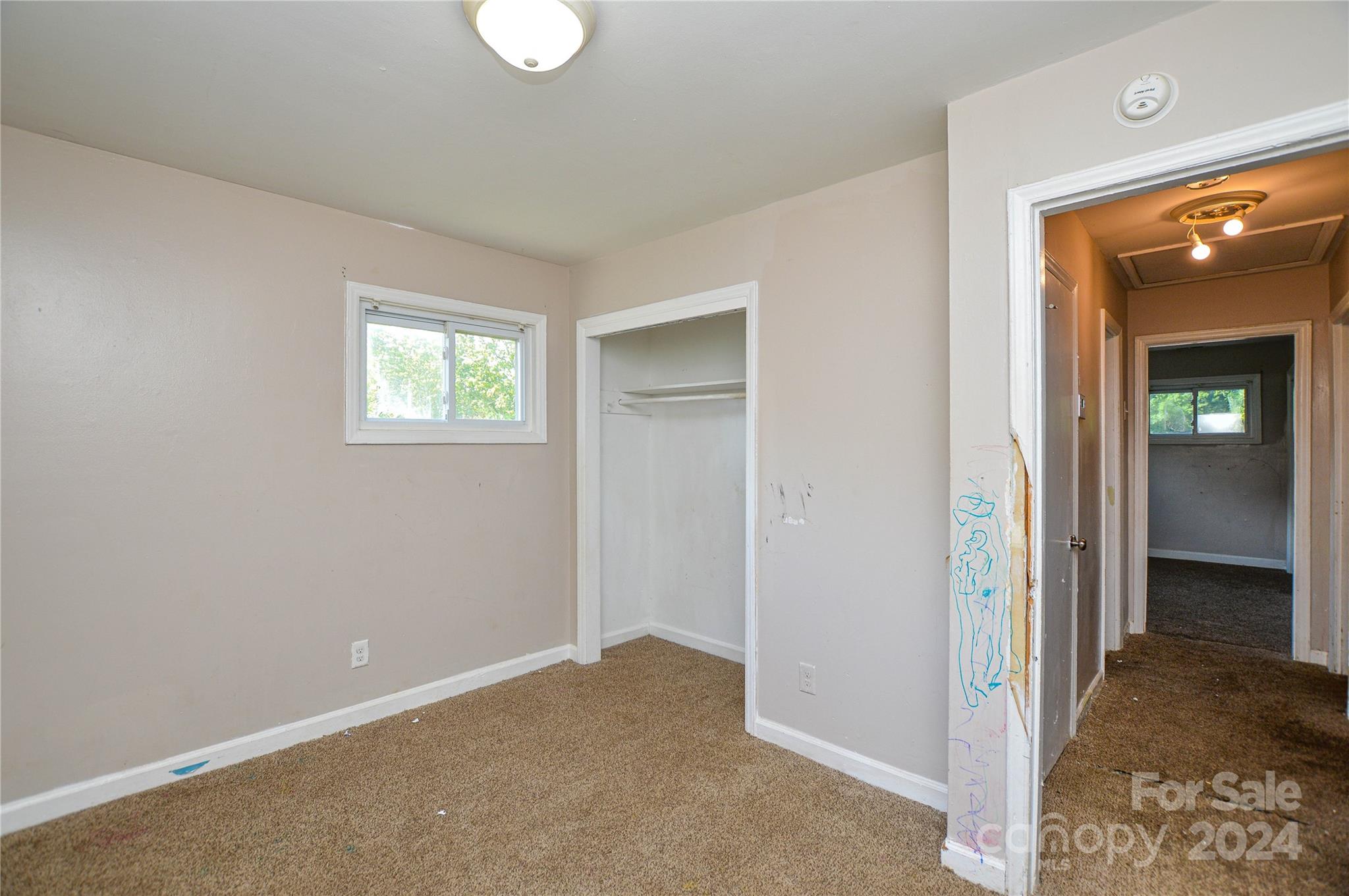 1138 White Plains Road Charlotte, NC 28213 - Photo 26 of 36 a view of an empty room with closet and a window