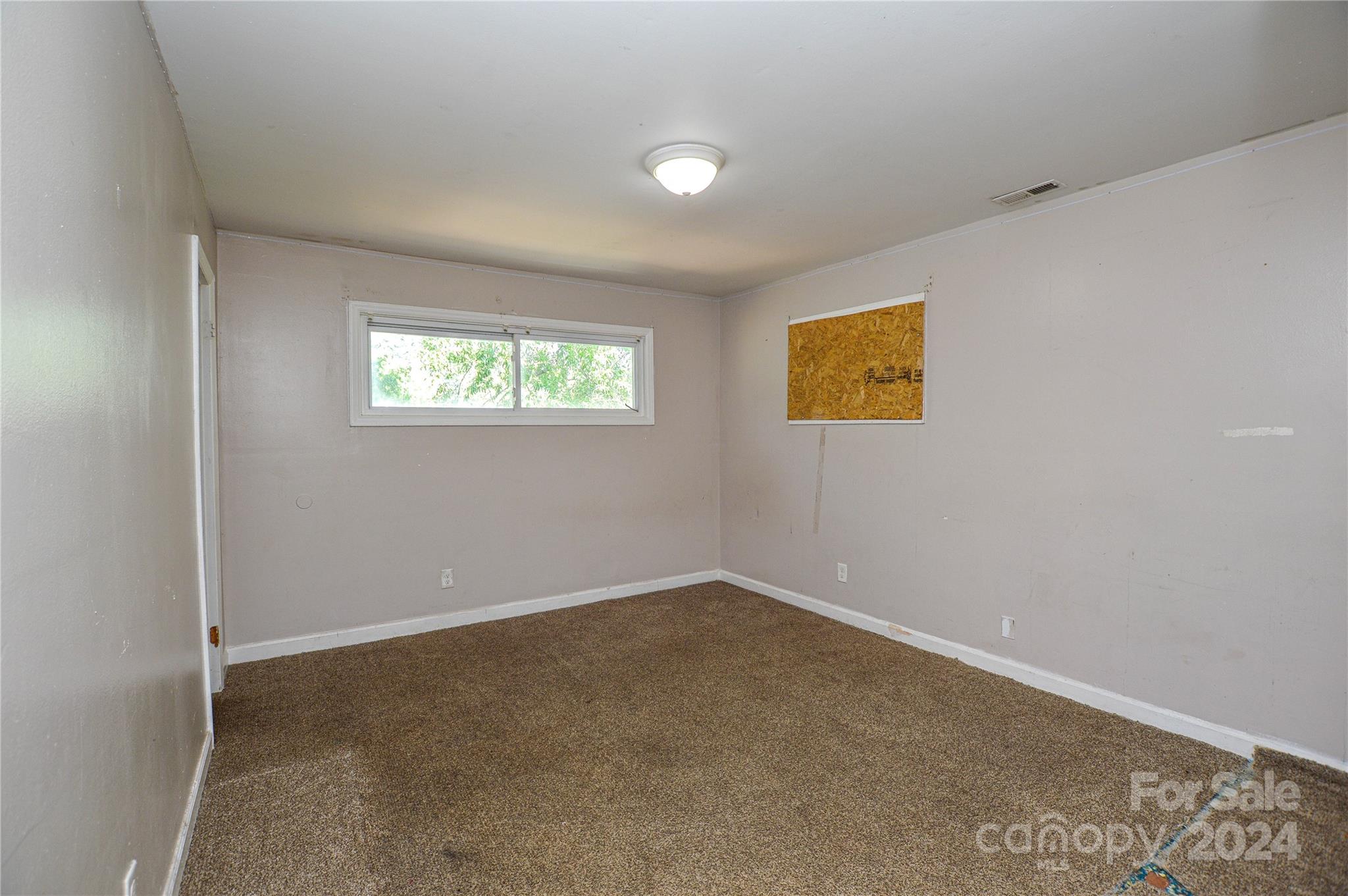 1138 White Plains Road Charlotte, NC 28213 - Photo 28 of 36 an empty room with windows