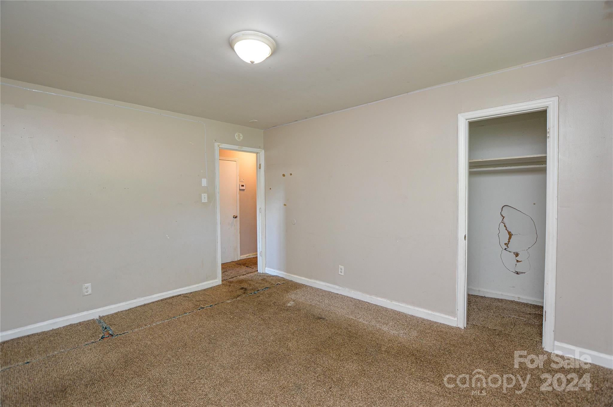 1138 White Plains Road Charlotte, NC 28213 - Photo 30 of 36 an empty room with windows and closet