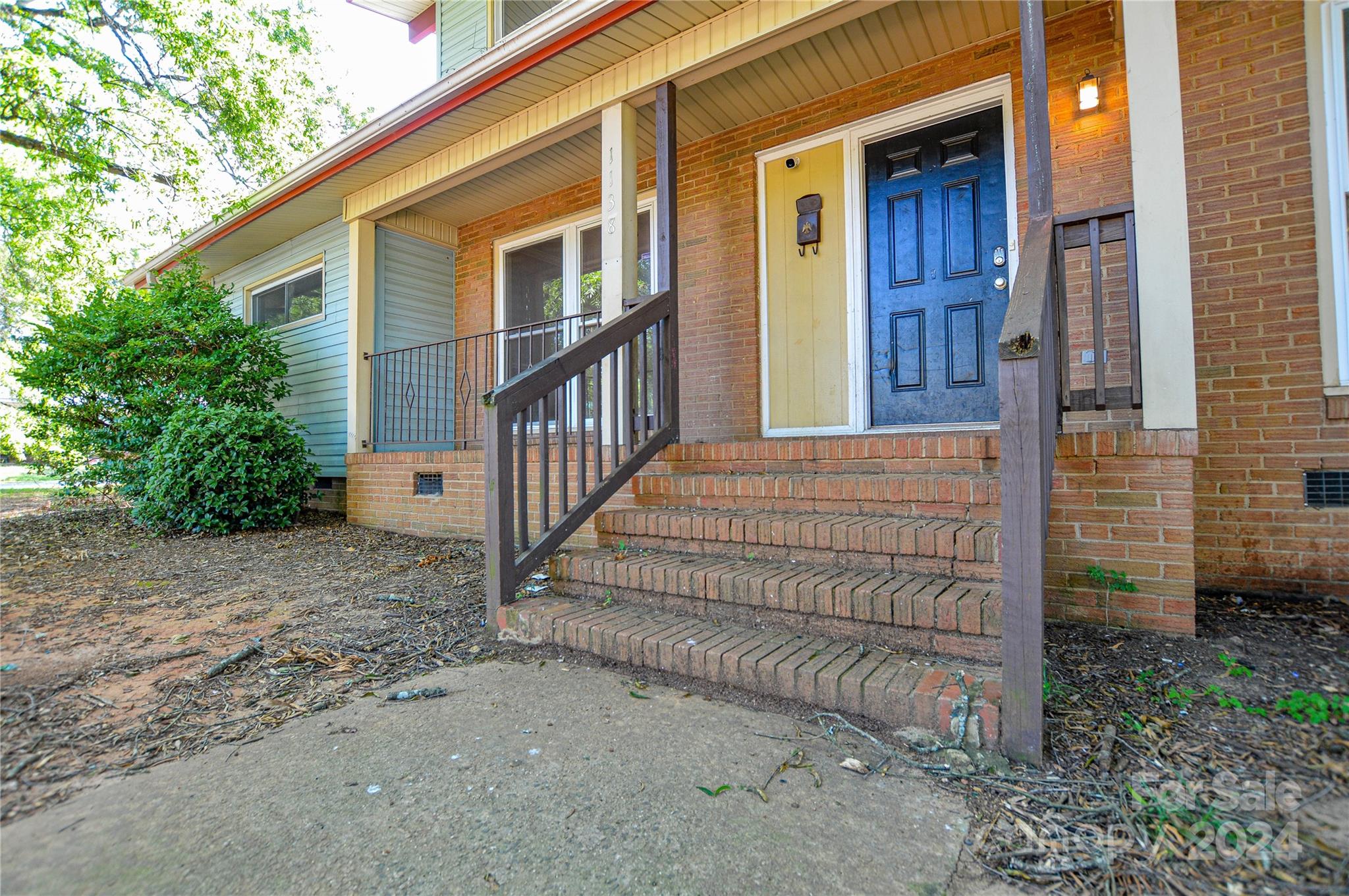 1138 White Plains Road Charlotte, NC 28213 - Photo 3 of 36 a view of a house with a small yard and wooden fence
