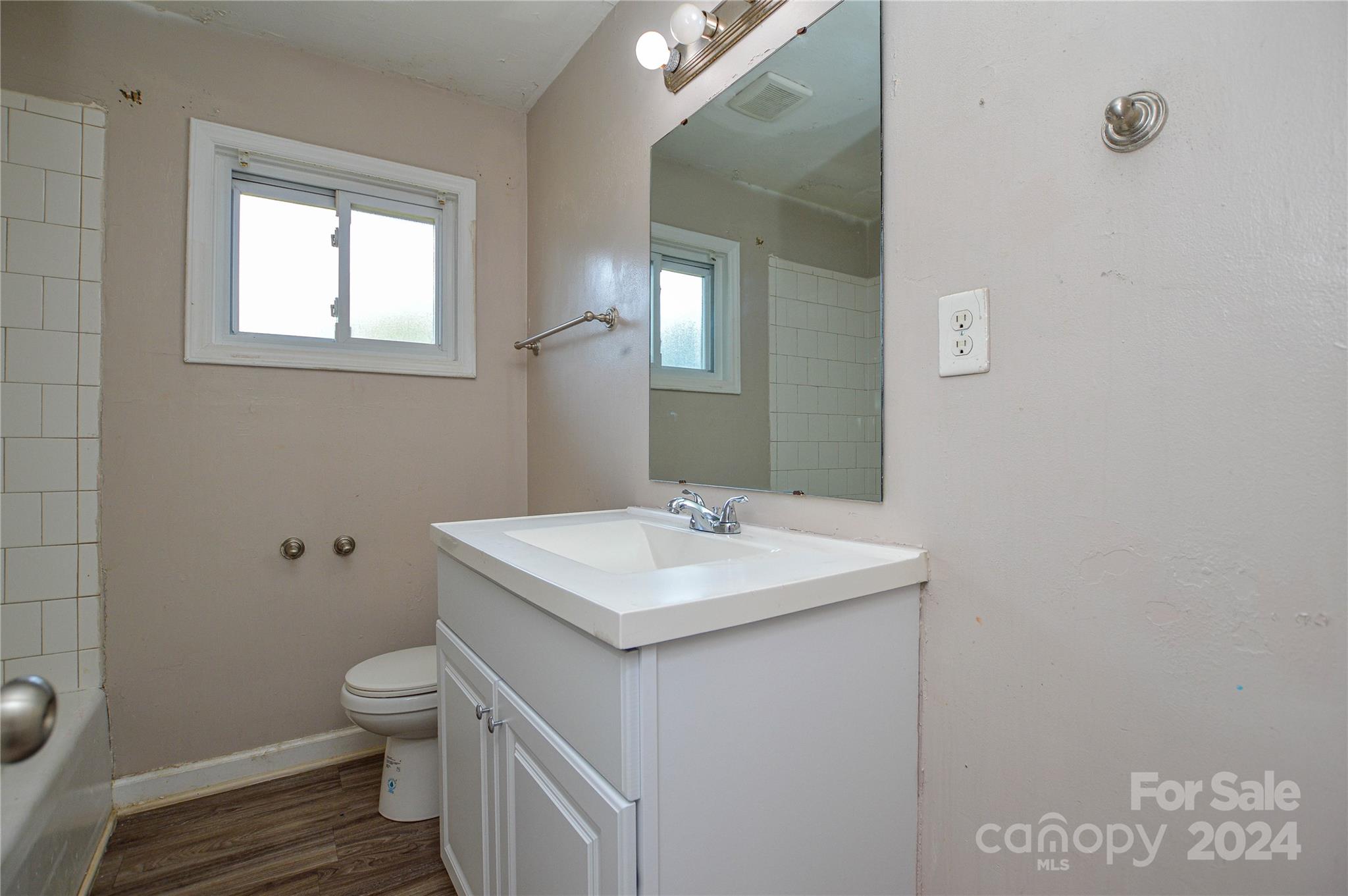 1138 White Plains Road Charlotte, NC 28213 - Photo 31 of 36 a bathroom with a sink toilet and mirror