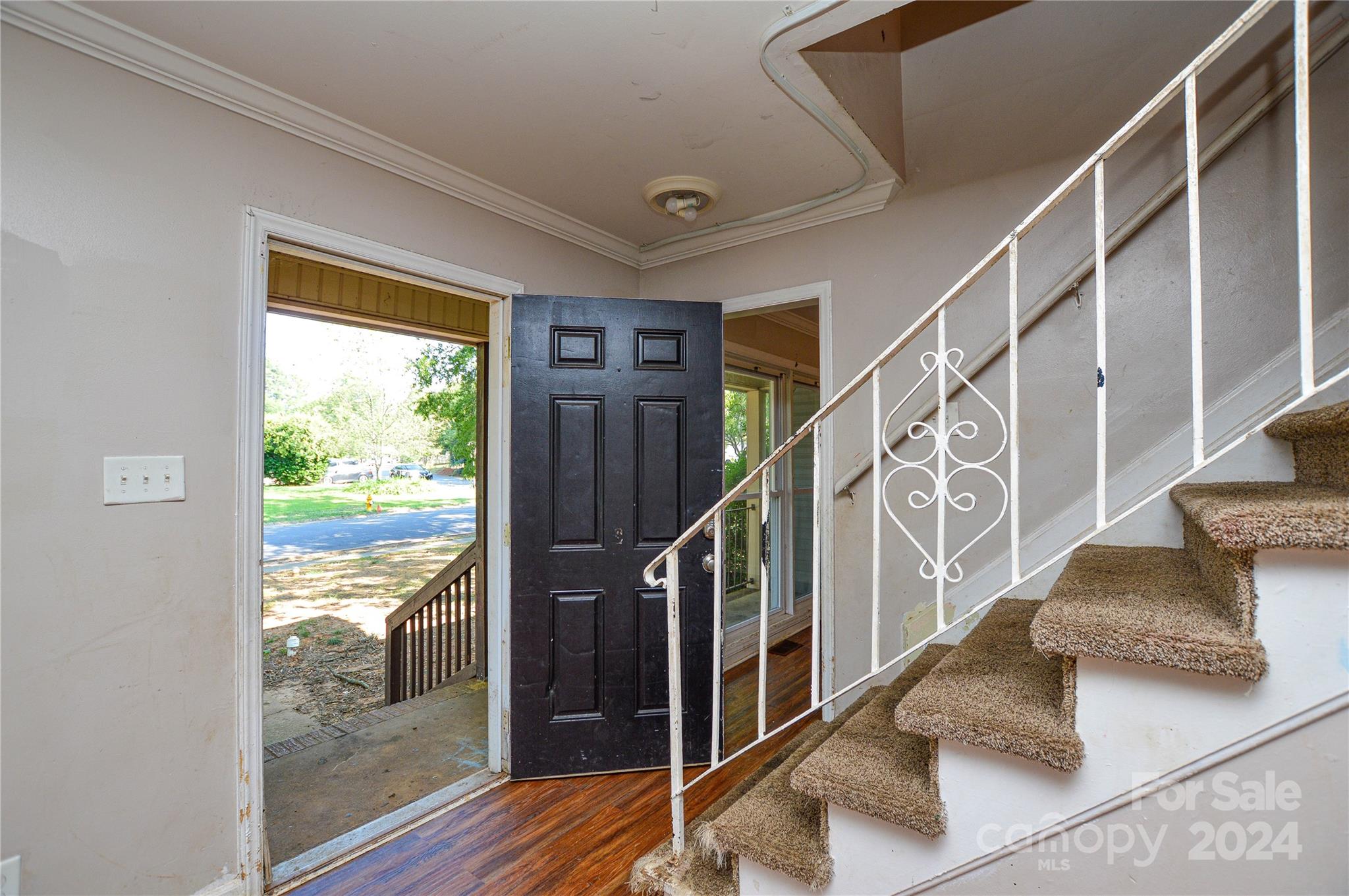 1138 White Plains Road Charlotte, NC 28213 - Photo 5 of 36 a view of entryway and hall with wooden floor