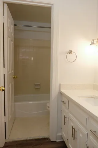 a bathroom with a shower and a sink