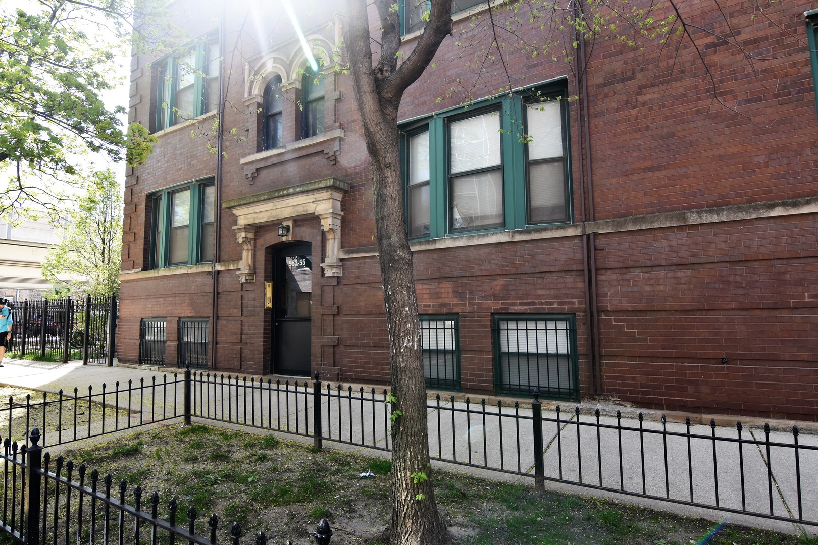 953 West Fletcher Street, Unit 1 Chicago, IL 60657 - Photo 1 of 23 a view of a brick house with iron fence