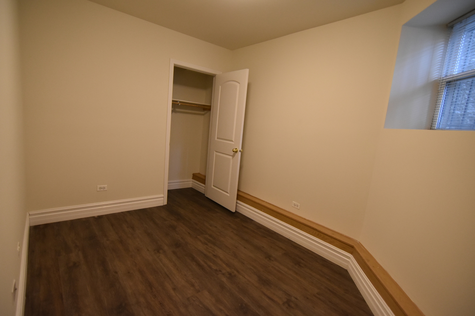 953 West Fletcher Street, Unit 1 Chicago, IL 60657 - Photo 16 of 23 an empty room with wooden floor and closet