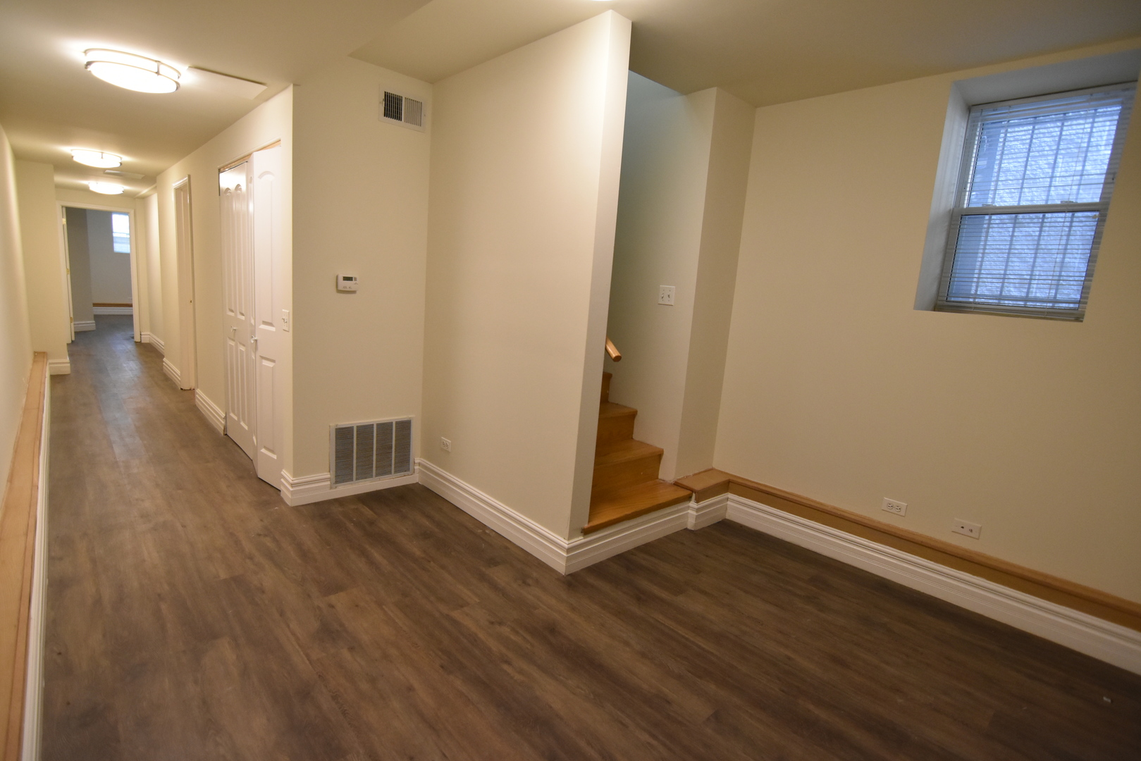 953 West Fletcher Street, Unit 1 Chicago, IL 60657 - Photo 18 of 23 a view of a hallway with wooden floor