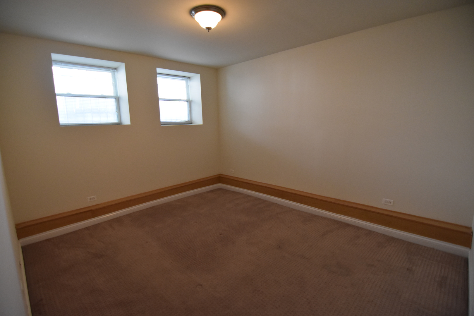 953 West Fletcher Street, Unit 1 Chicago, IL 60657 - Photo 20 of 23 an empty room with windows