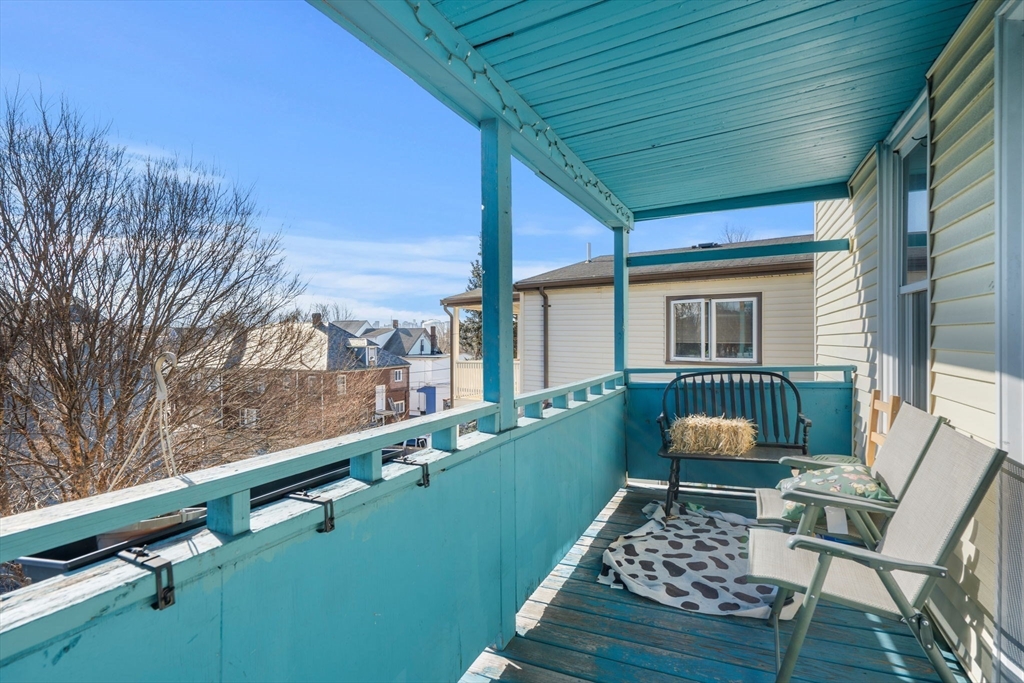 67 School Street Everett, MA 02149 - Photo 36 of 37 a view of a chairs and table on the deck