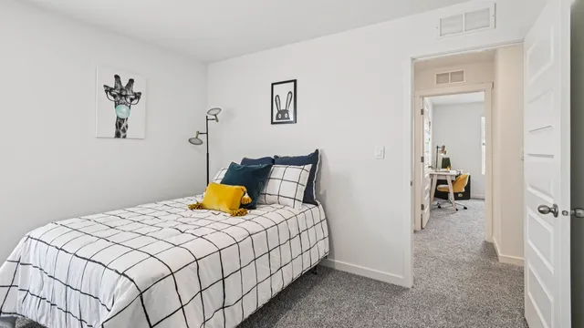 a bedroom with a bed and a table