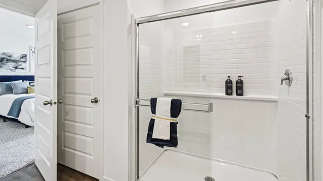 a bathroom with a shower and a sink