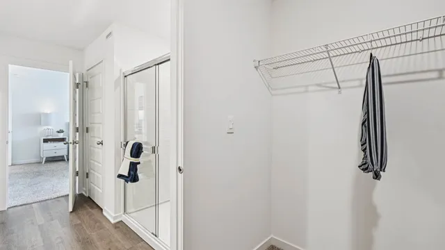 a bathroom with a shower and a sink