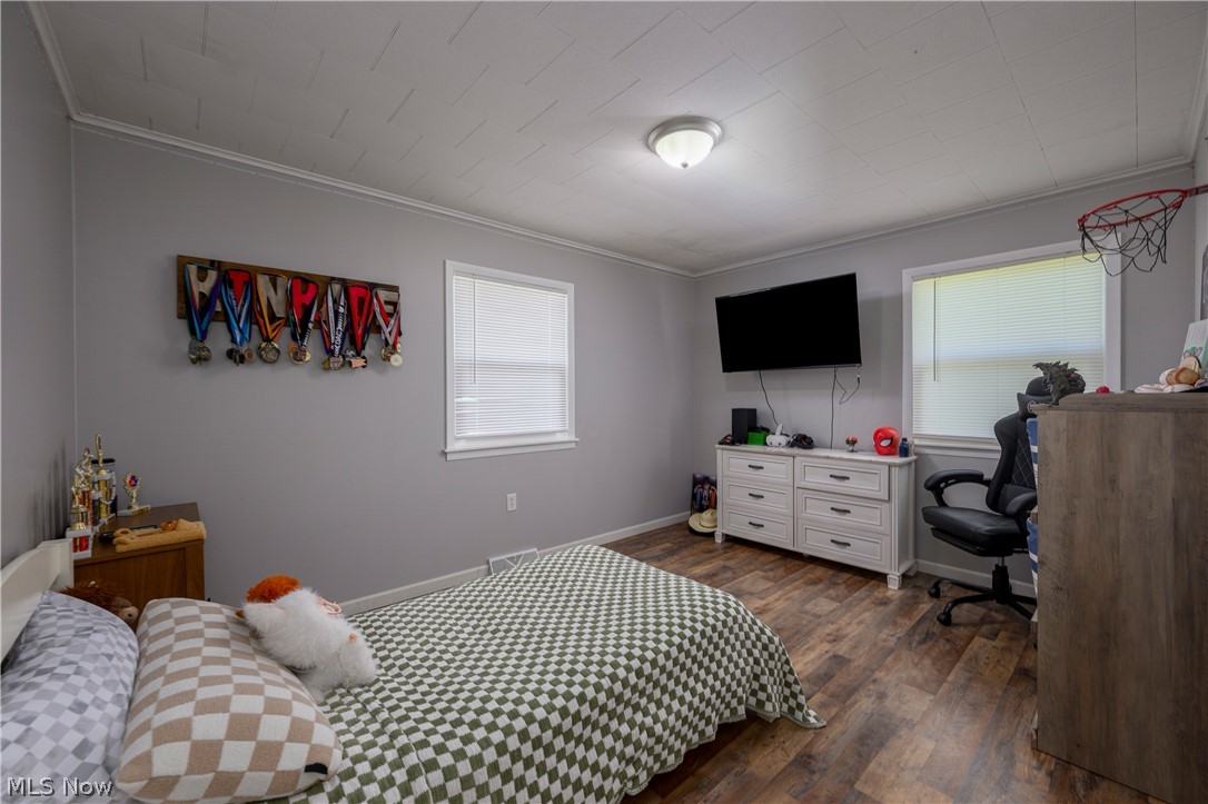 6105 Wolf Run Road Southeast Dennison, OH 44621 - Photo 27 of 35 Room featuring wood-finish flooring, light gray wall paint, and white trim