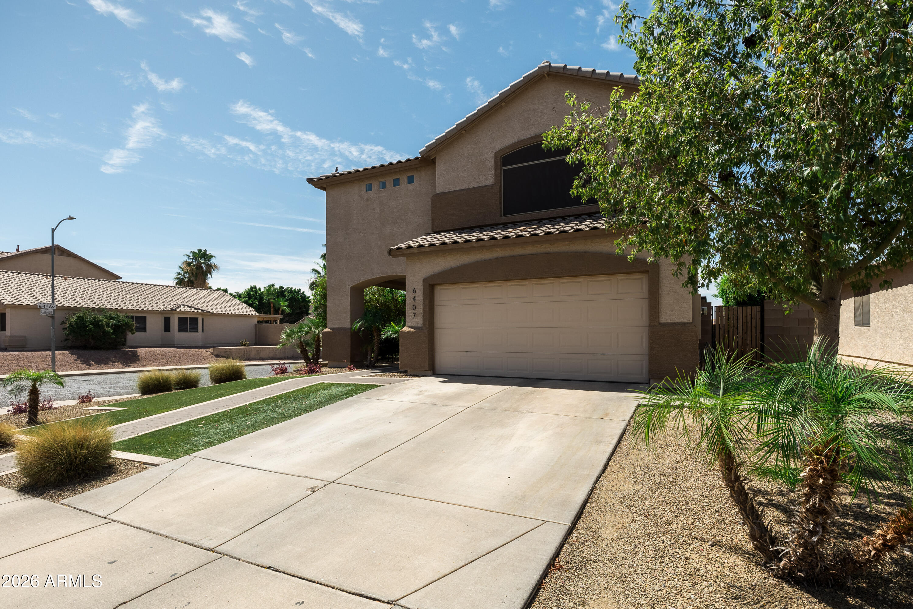 6407 West Saddlehorn Road Phoenix, AZ 85083 - Photo 2 of 41 a front view of a house with a yard and garage