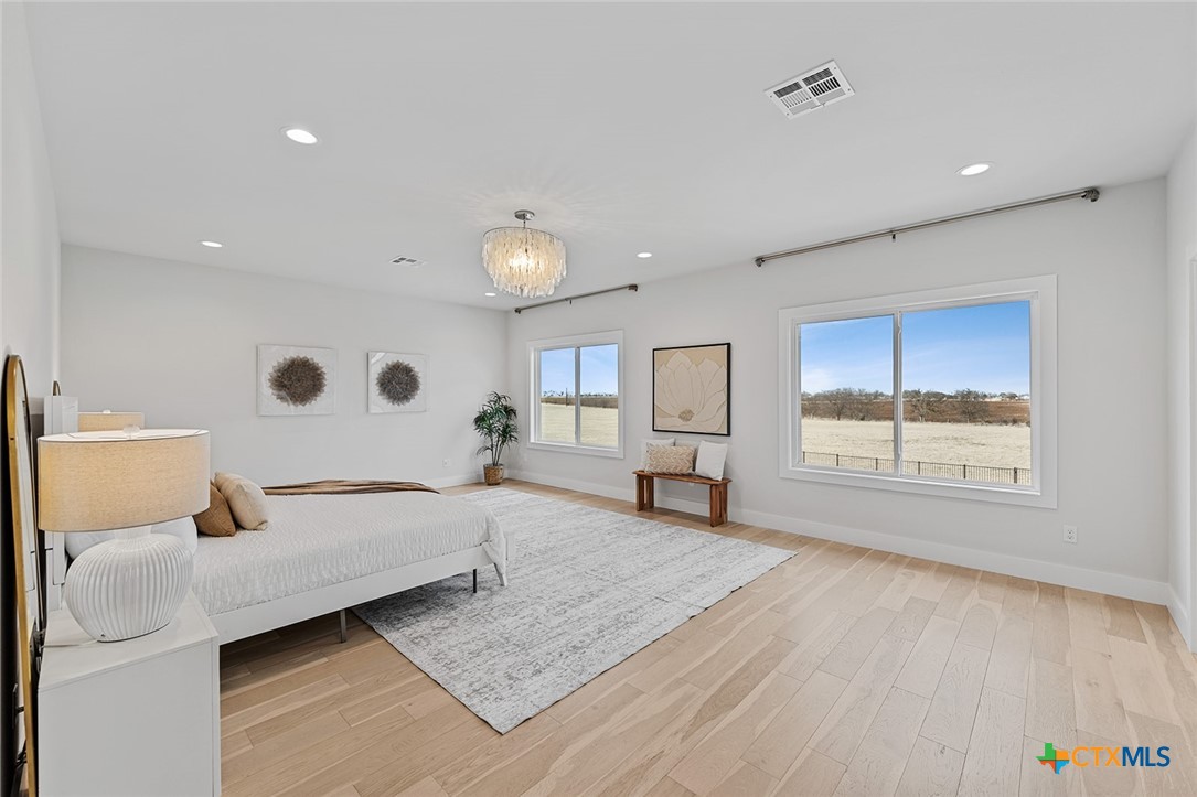 477 Willow Moon Ranch Road Crawford, TX 76638 - Photo 21 of 40 a living room with furniture and a window