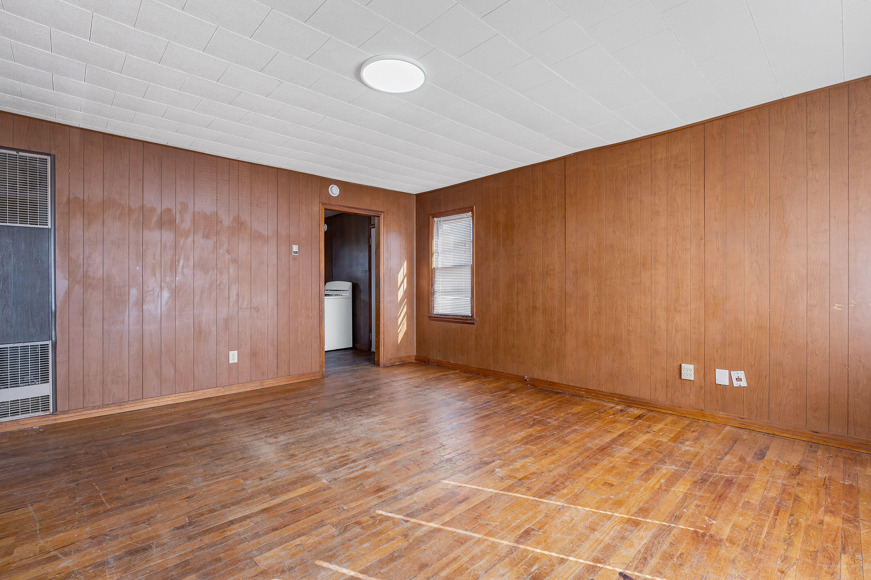 2808 1st Street Lubbock, TX 79415 - Photo 2 of 9 a view of an empty room with wooden floor and closet