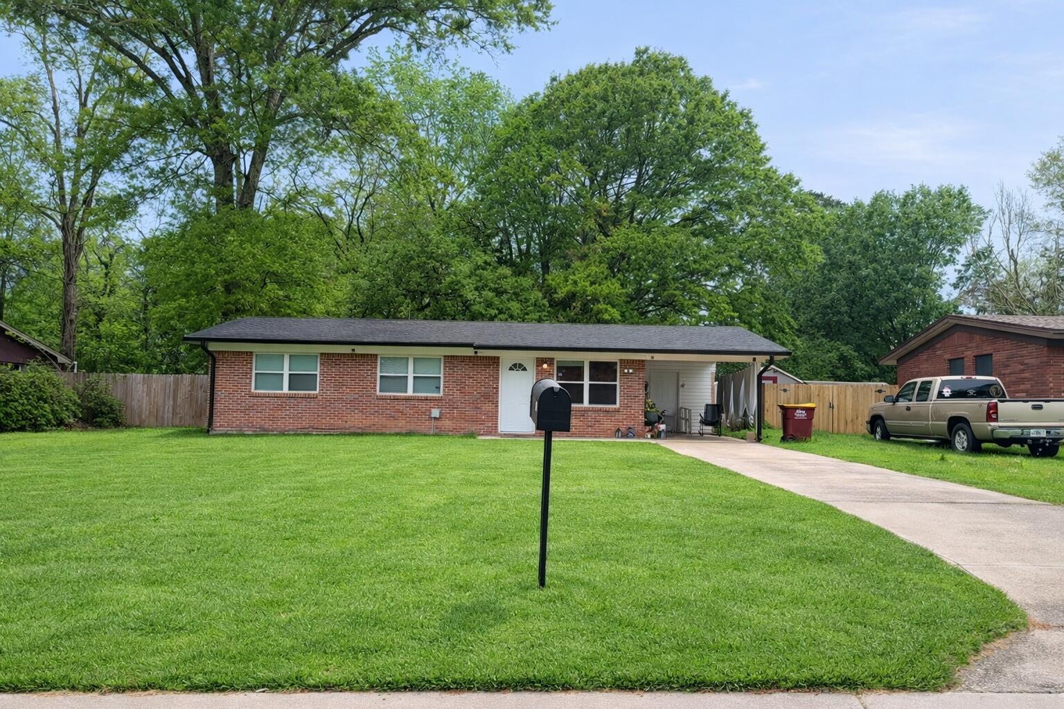 a house that is sitting in the grass