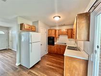 138 Shady Lane Crestview, FL 32536 - Photo 4 of 10 a view of a kitchen with a refrigerator and a sink