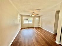 138 Shady Lane Crestview, FL 32536 - Photo 6 of 10 an empty room with wooden floor and windows