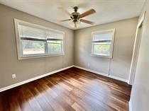 138 Shady Lane Crestview, FL 32536 - Photo 7 of 10 a view of an empty room with a window and wooden floor