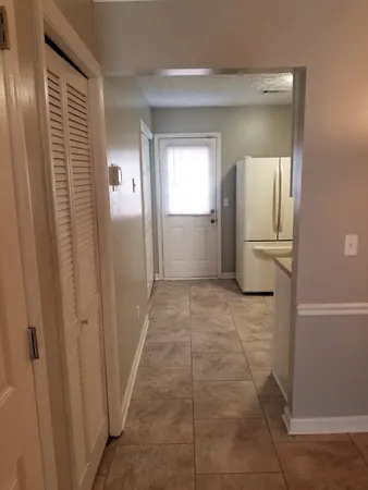 a bathroom with a shower and closet