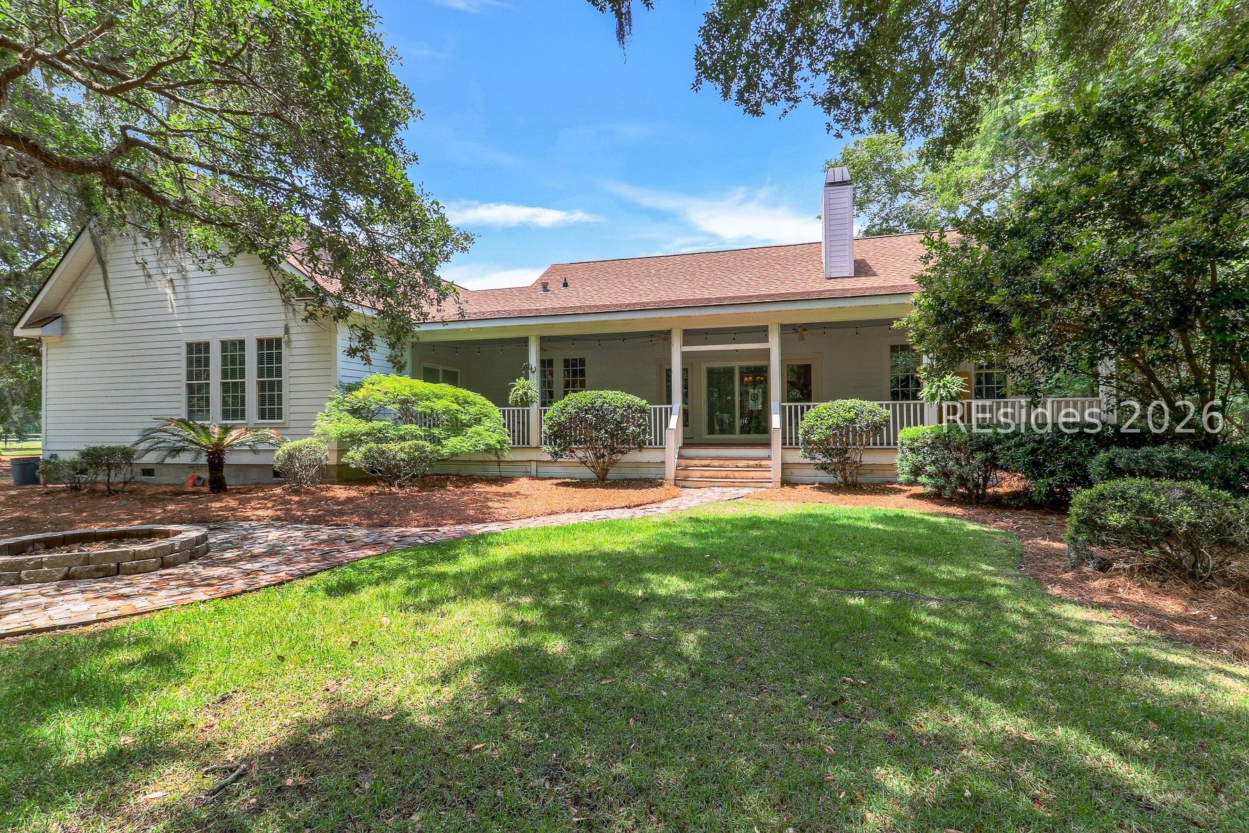 7724 Bees Creek Road Ridgeland, SC 29936 - Photo 3 of 82 Back of Home with Beautiful Live Oaks and Fire Pit